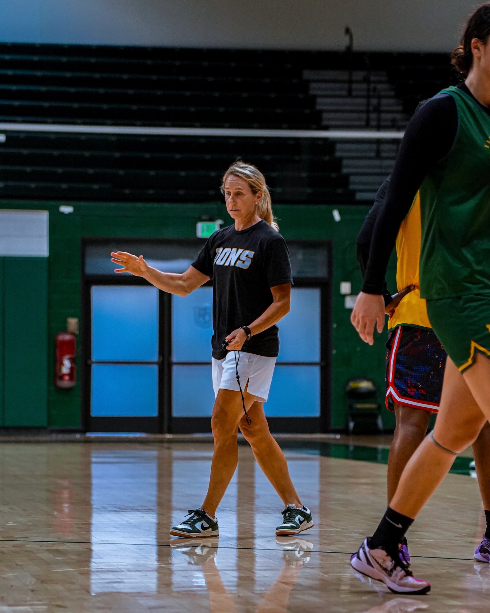 USF Dons guard driving baseline under the rim at practice